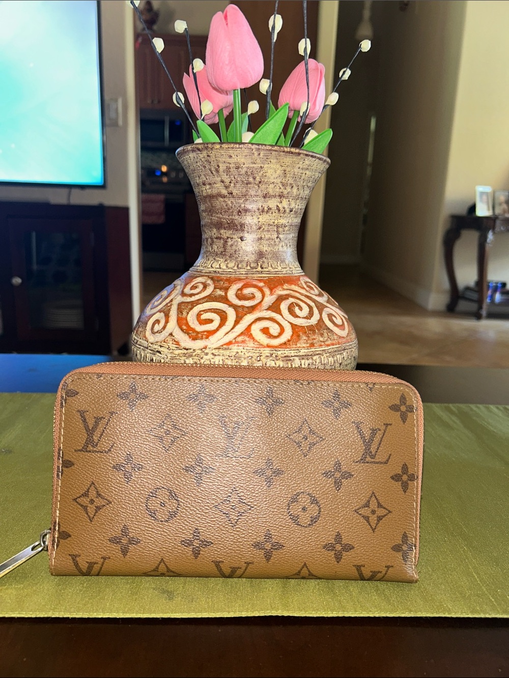 Reverse Monogram Zippy Wallet in coated canvas.